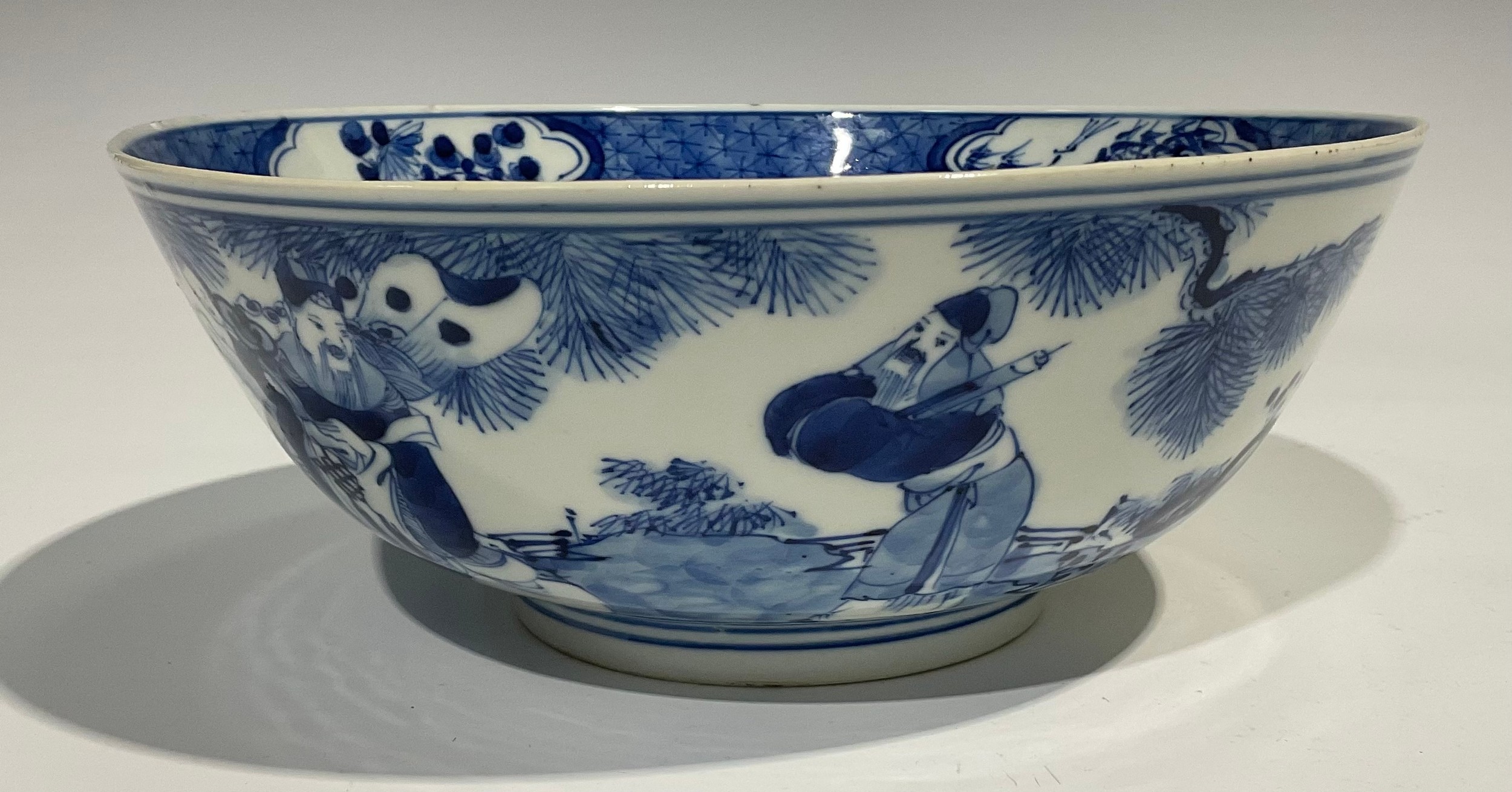 A Chinese circular bowl, playing in tones of underglaze blue with figures in a monumental landscape, - Image 2 of 8