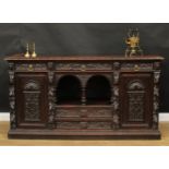 A 19th century historicist oak low dog-kennel dresser or side cabinet, rectangular top with