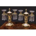A pair of 19th century French gilt metal and alabaster two-light mantel candle lustres, each centred