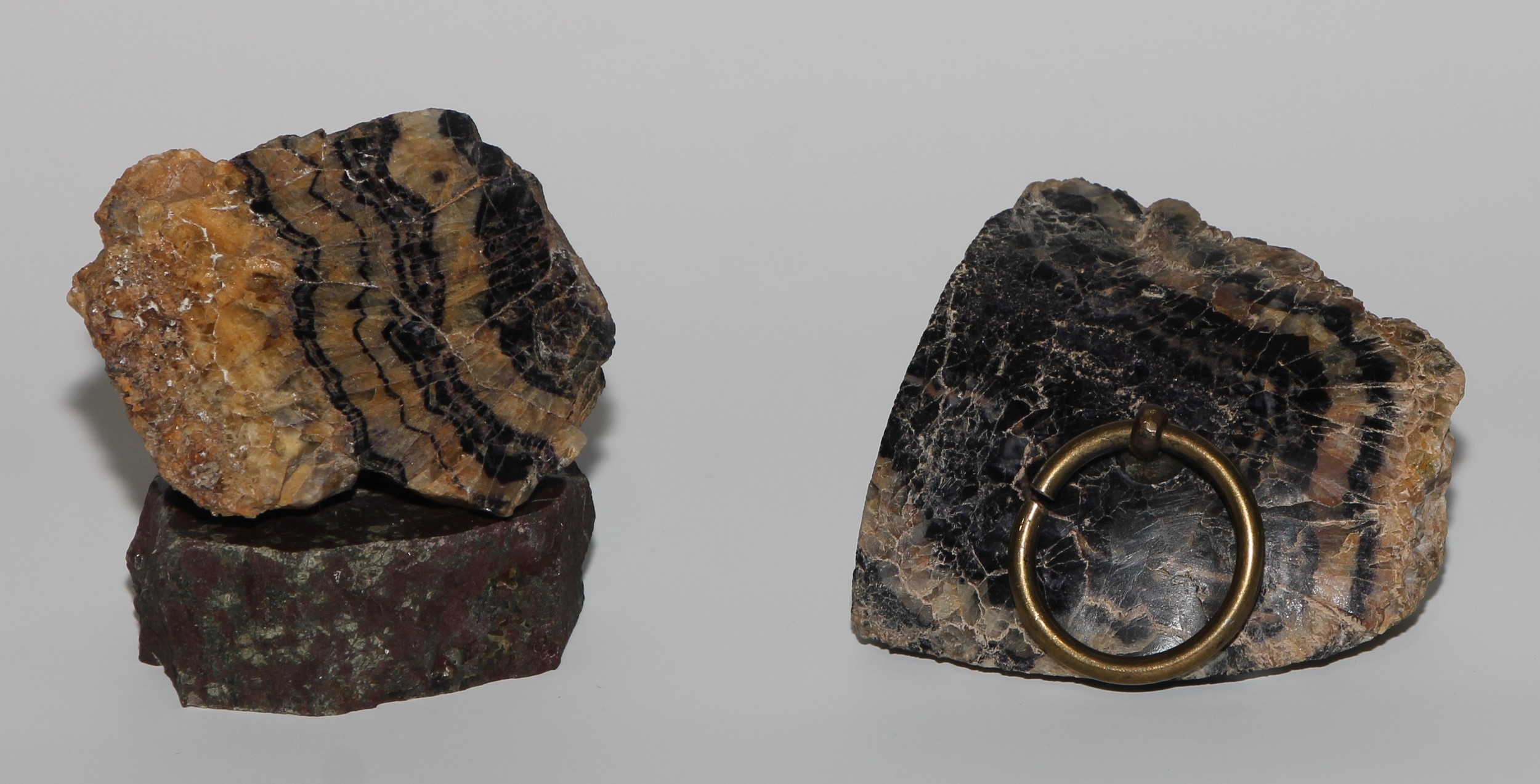 A 19th century Derbyshire Blue John desk weight, brass ring handle, 7cm wide; a specimen, mounted