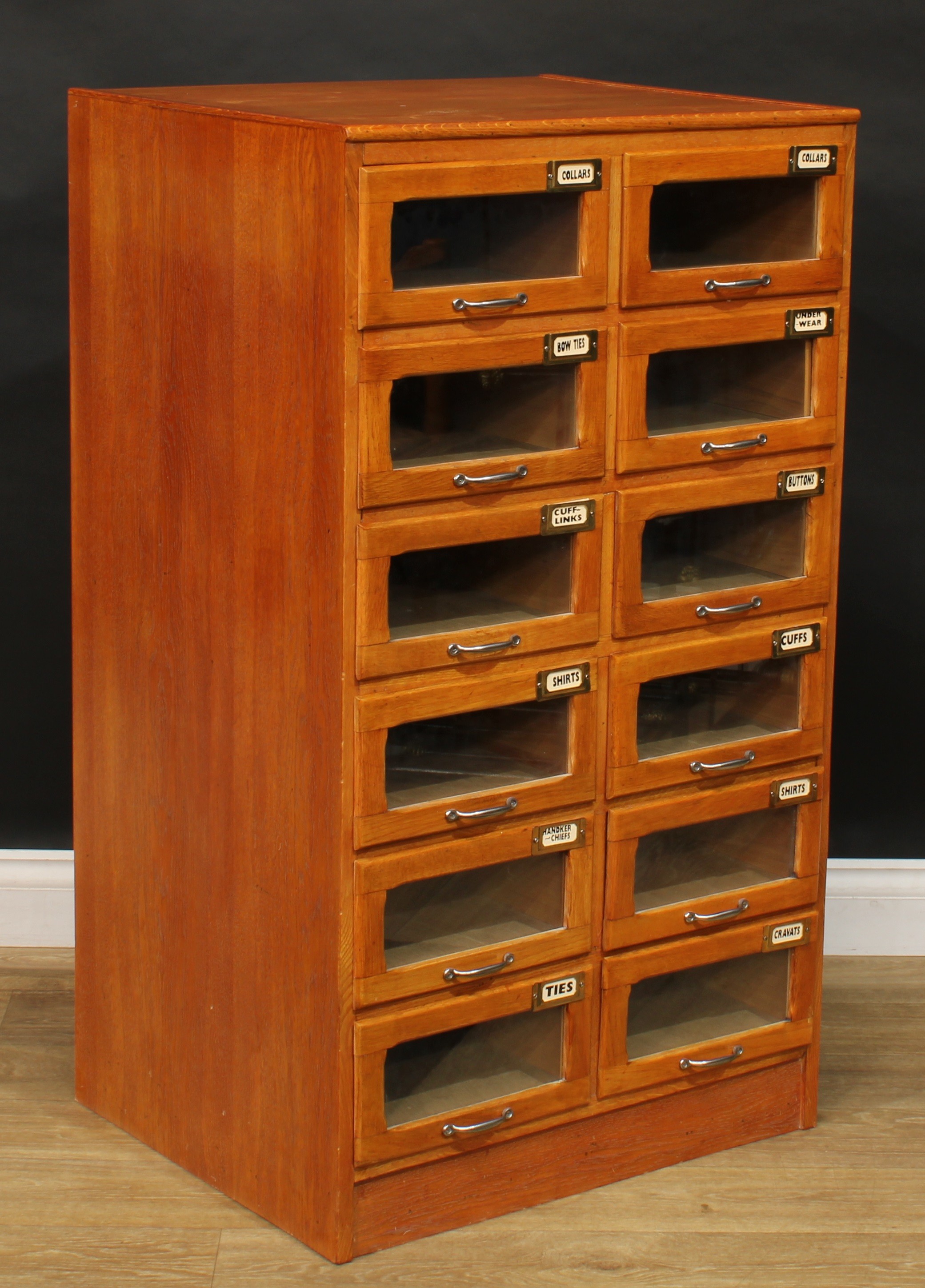 An early to mid 20th century oak haberdashery shop display chest, rectangular top above twelve - Image 2 of 5