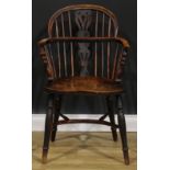 A 19th century East Midlands yew, ash and elm Windsor elbow chair, low hoop back, shaped and pierced