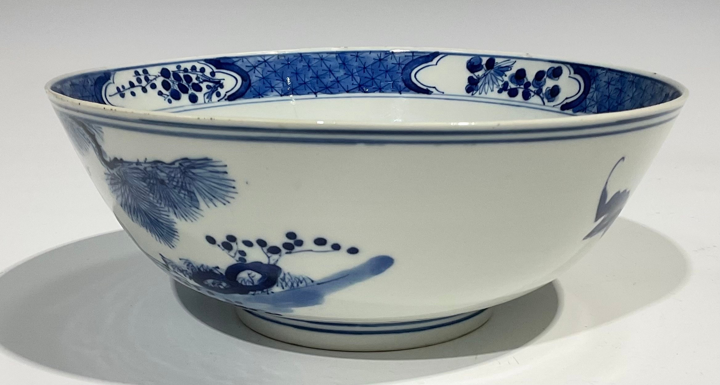 A Chinese circular bowl, playing in tones of underglaze blue with figures in a monumental landscape, - Image 4 of 8