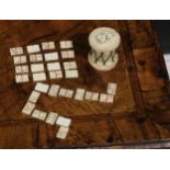 An early 19th century French Napoleonic Prisoner-of-War carved bone Domino set, the case as a