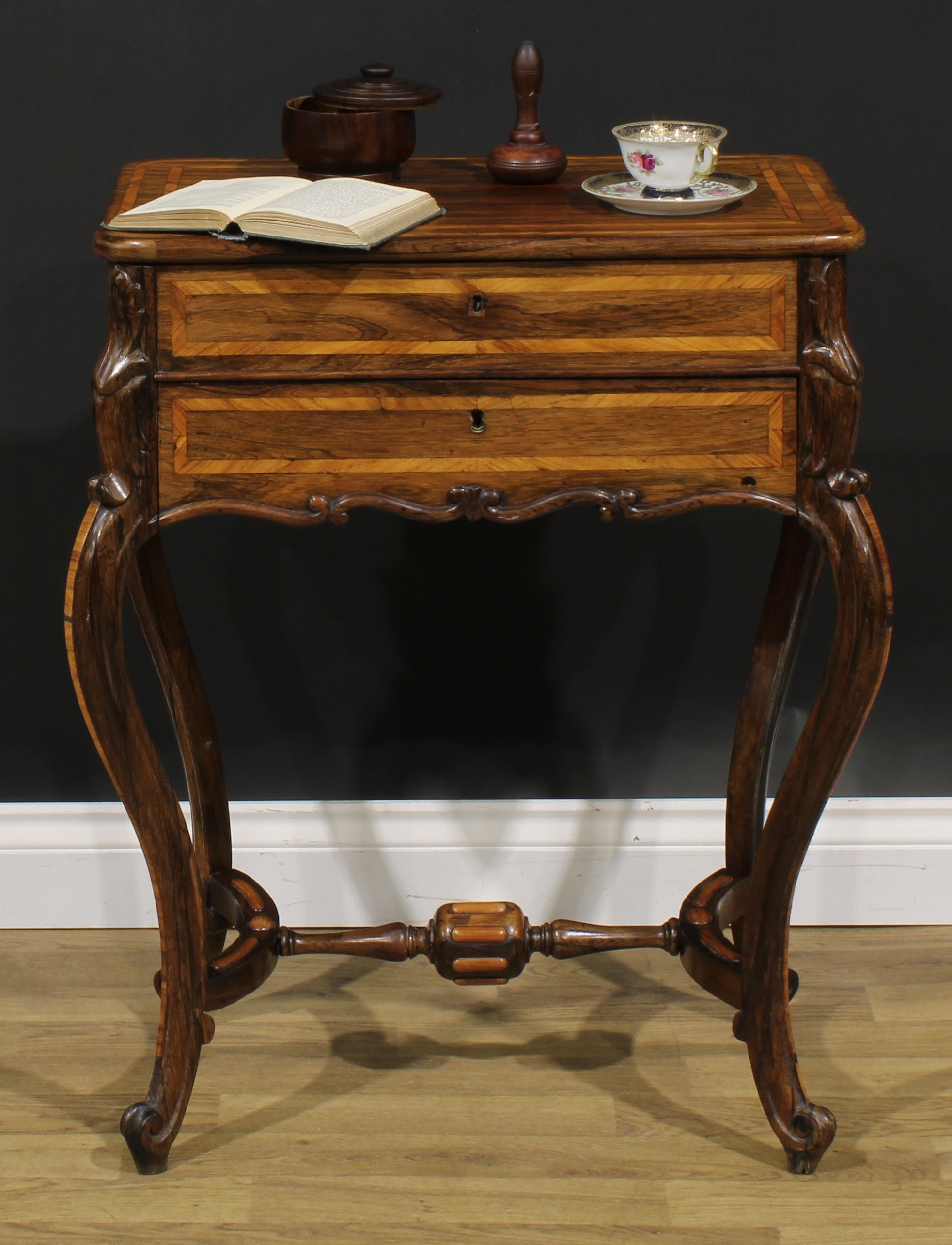 A Louis XV Revival kingwood banded rosewood work table, hinged top above a long apron drawer, French