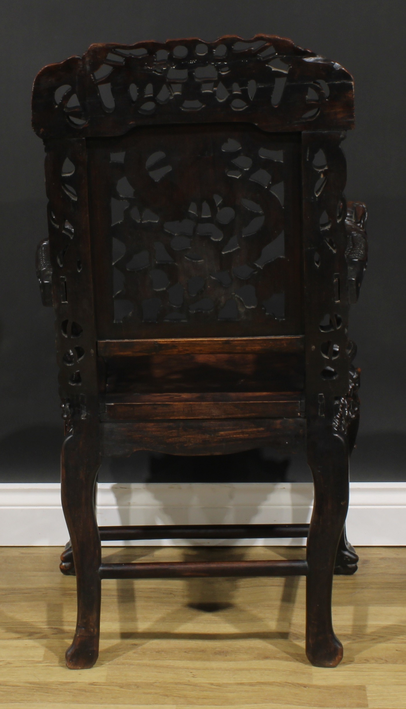 A Chinese hardwood armchair, carved throughout with dragons, serpentine seat with beaded border, - Image 4 of 4