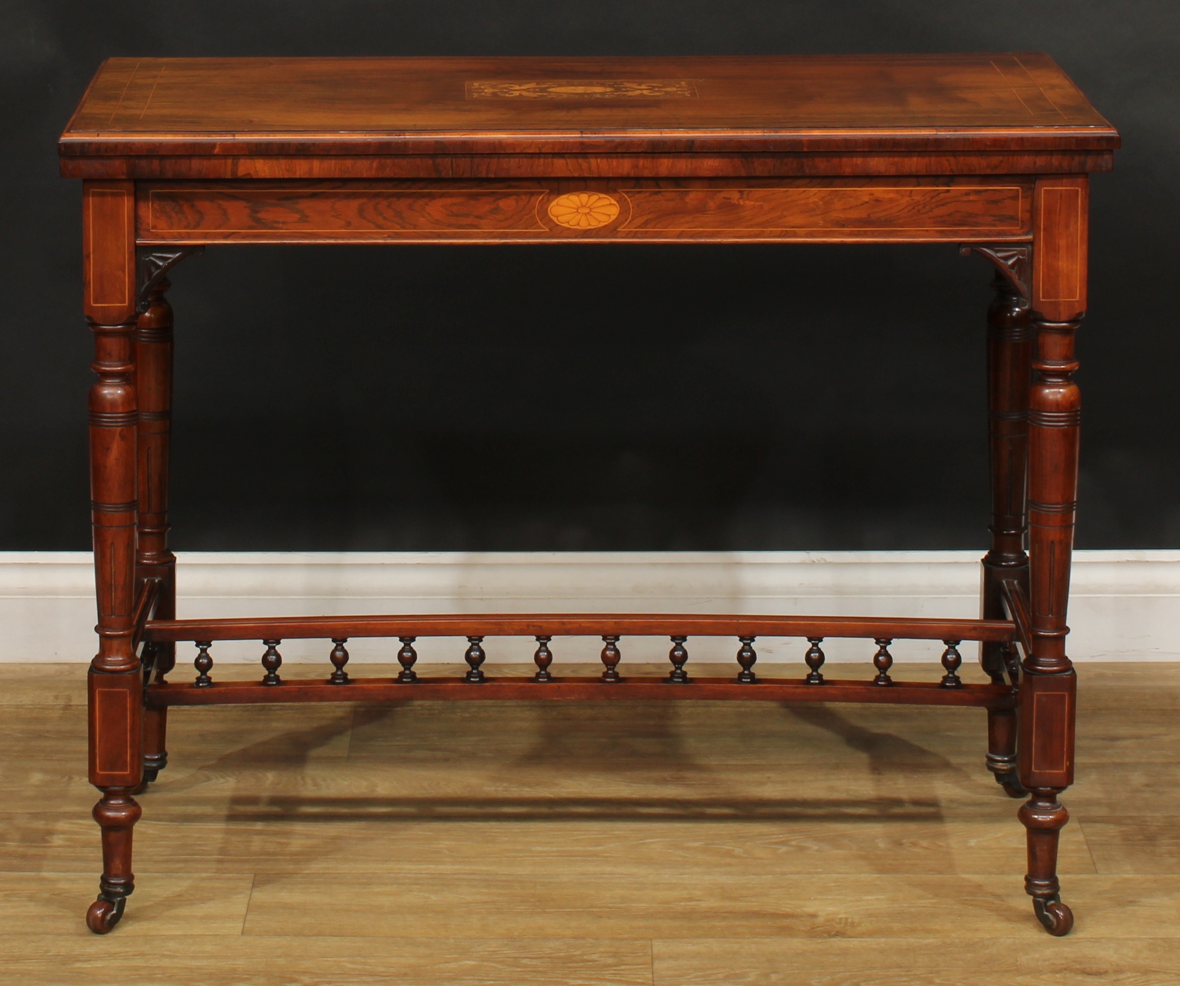 A late Victorian rosewood and marquetry card table, in the manner of Gillows of Lancaster and