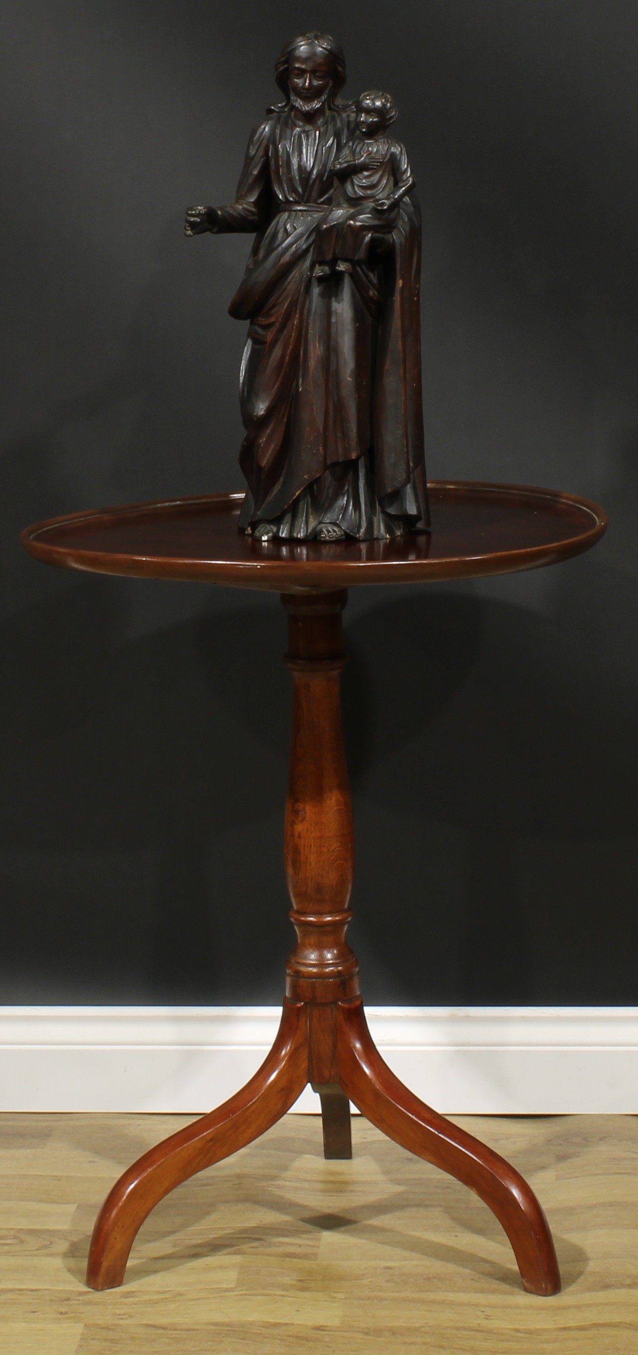 A 19th century mahogany and oak tripod occasional table, dished circular top, turned column,
