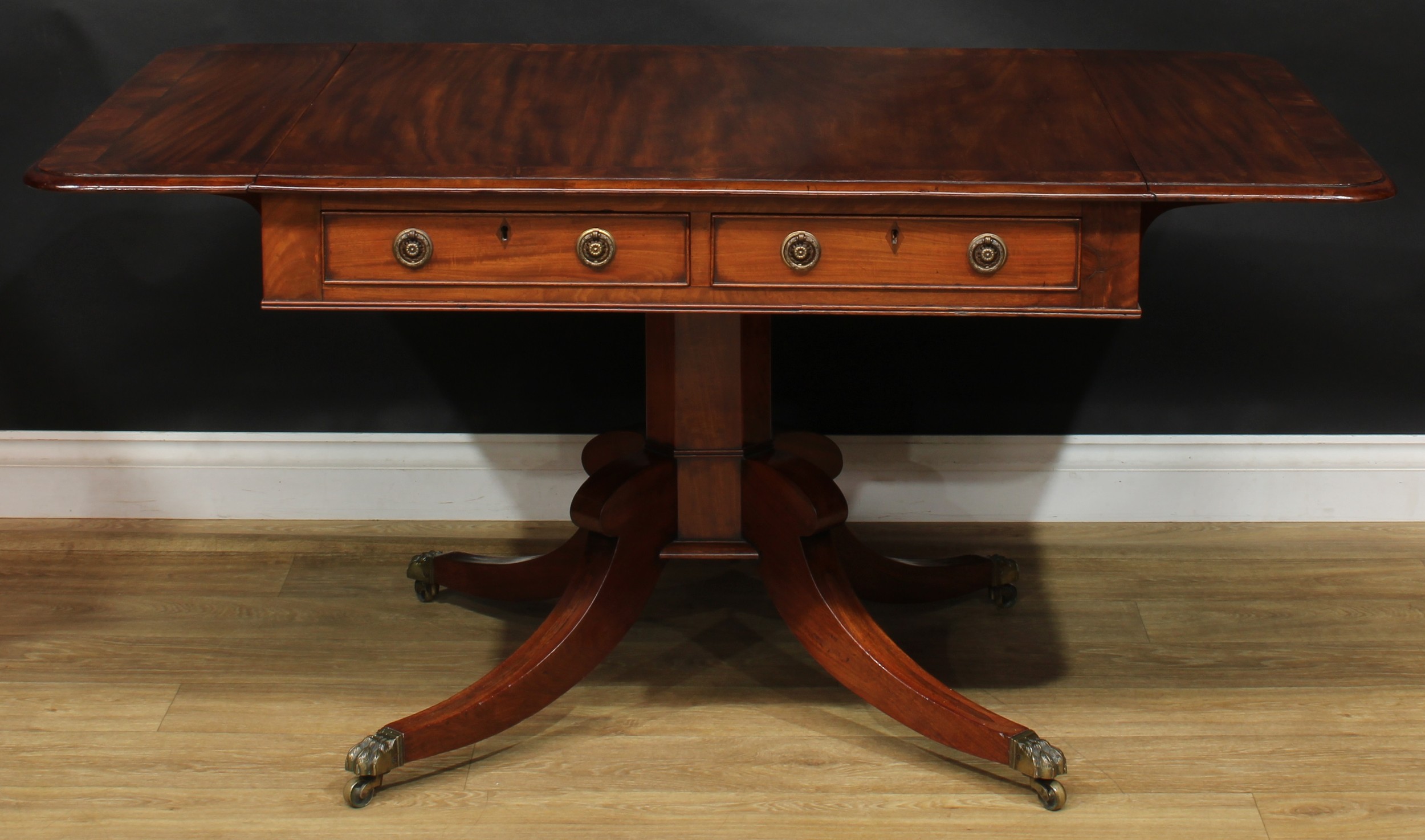 A Regency flame crossbanded mahogany sofa table, rounded rectangular top with fall leaves above a - Image 3 of 7