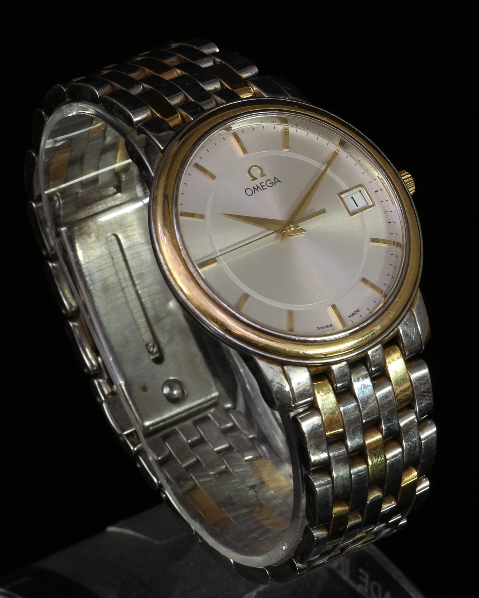 A Gentleman's Omega wristwatch, circular engine turned silvered dial, gilt baton house markers,