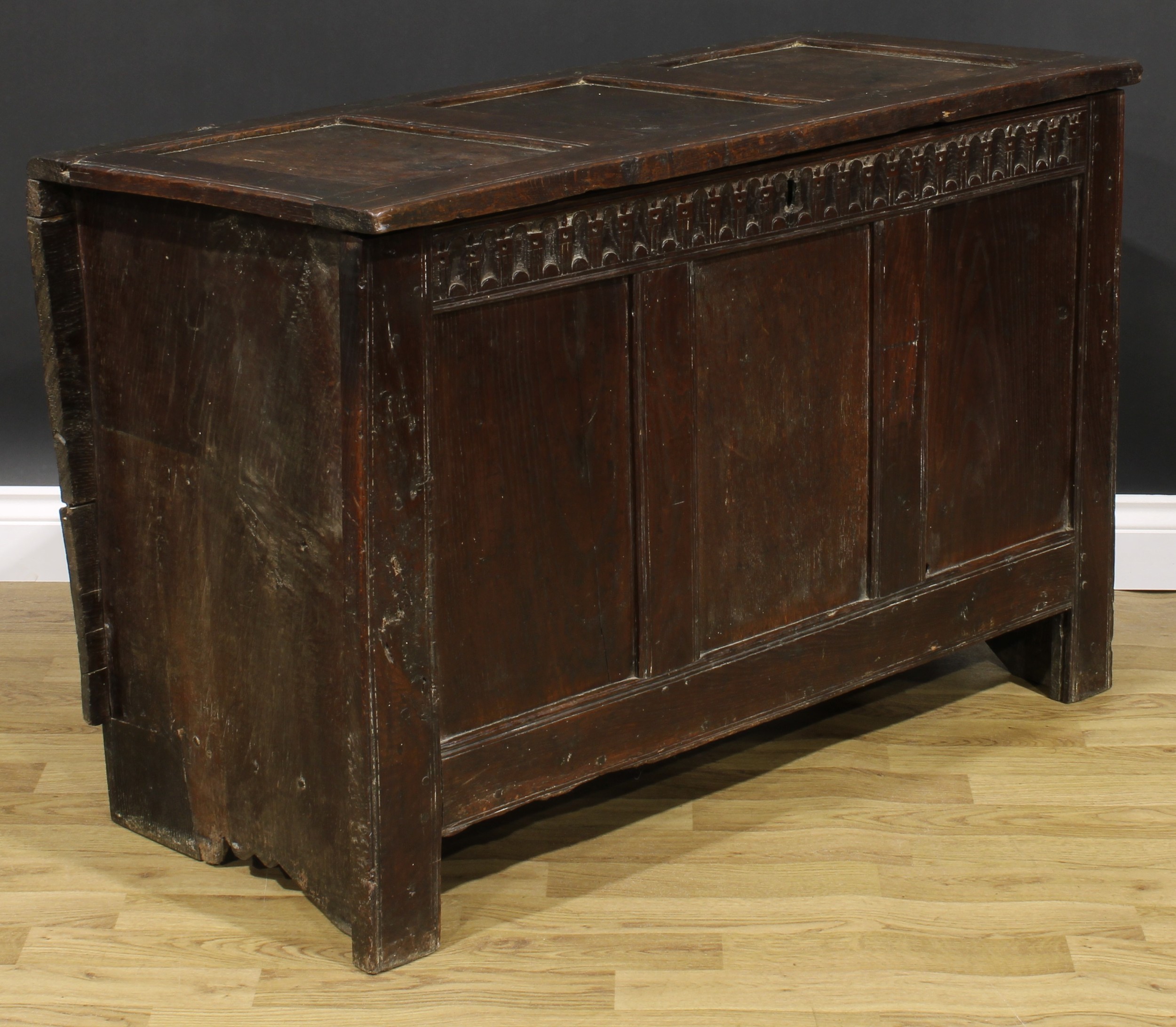 A 17th century oak blanket chest, hinged top, nulled frieze, three panel front, 74cm high, 115cm - Image 2 of 5