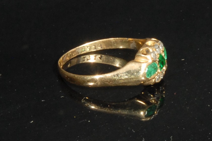 An 18ct gold 18th century style ring, set with three emeralds, flanked by six old cut diamond chips, - Image 2 of 2