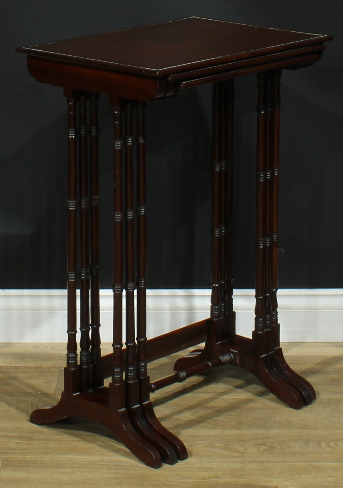 A nest of three George III Revival mahogany occasional tables, each with a rectangular top, turned - Image 3 of 5