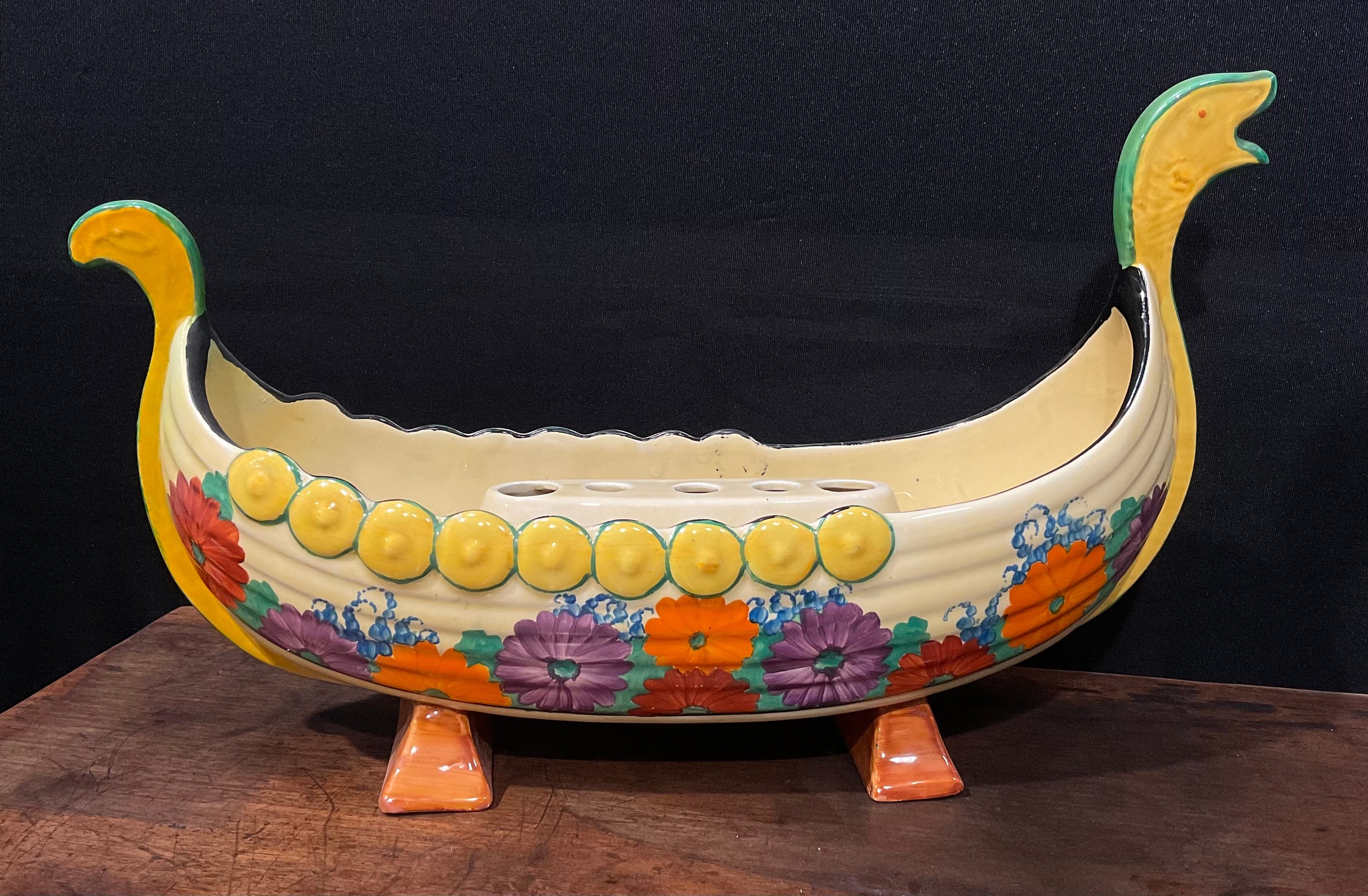 A Clarice Cliff Bizarre Gayday pattern table centre, modelled as a Viking long boat, with