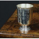 A French silver pedestal beaker, quite plain, slightly flared rim, domed fluted foot, 10.5cm high,