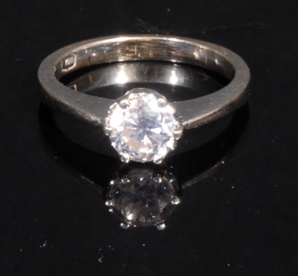 A diamond and 18ct white gold solitaire ring, the claw set round brilliant cut stone approx. 0.96ct,