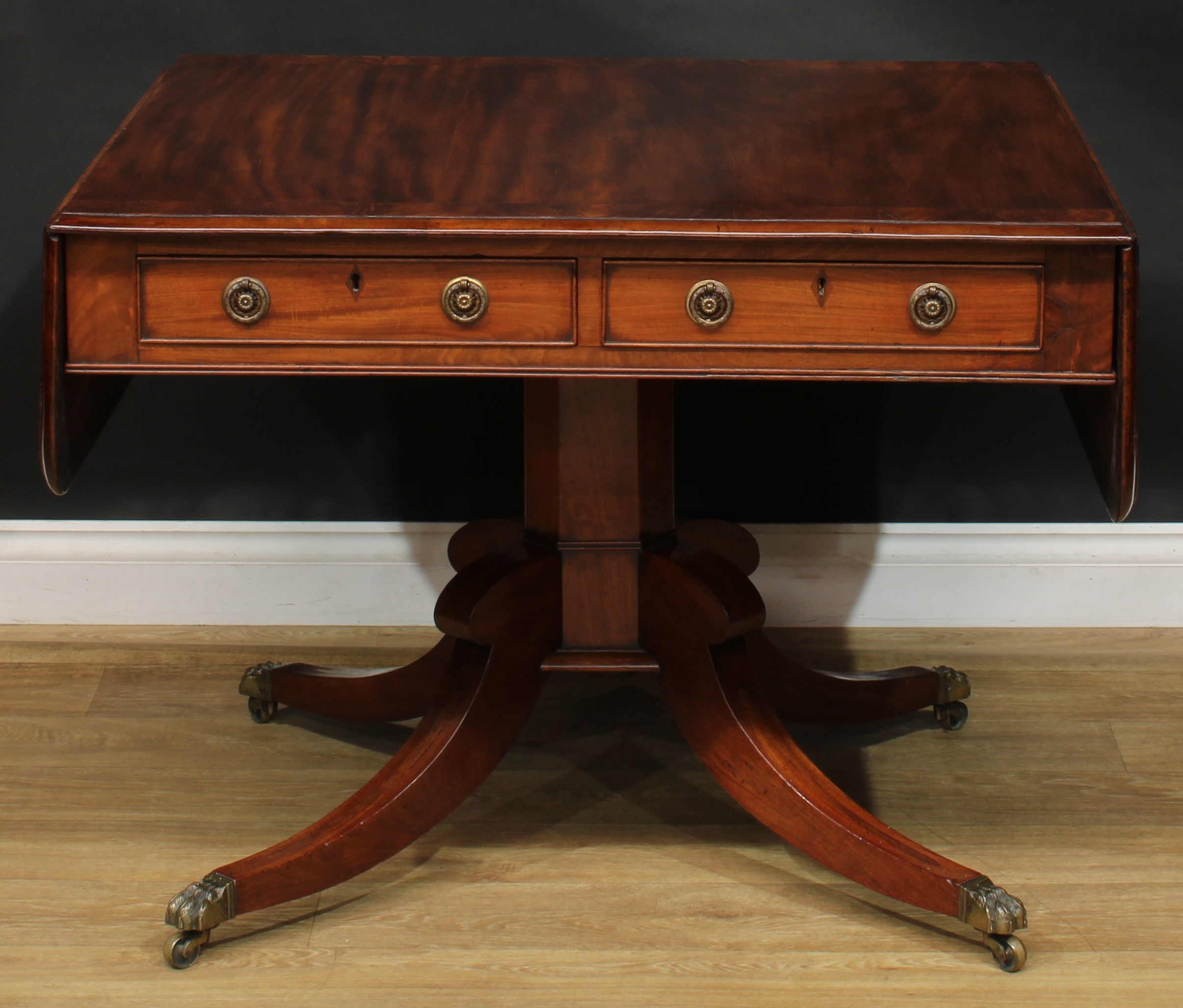 A Regency flame crossbanded mahogany sofa table, rounded rectangular top with fall leaves above a - Image 2 of 7