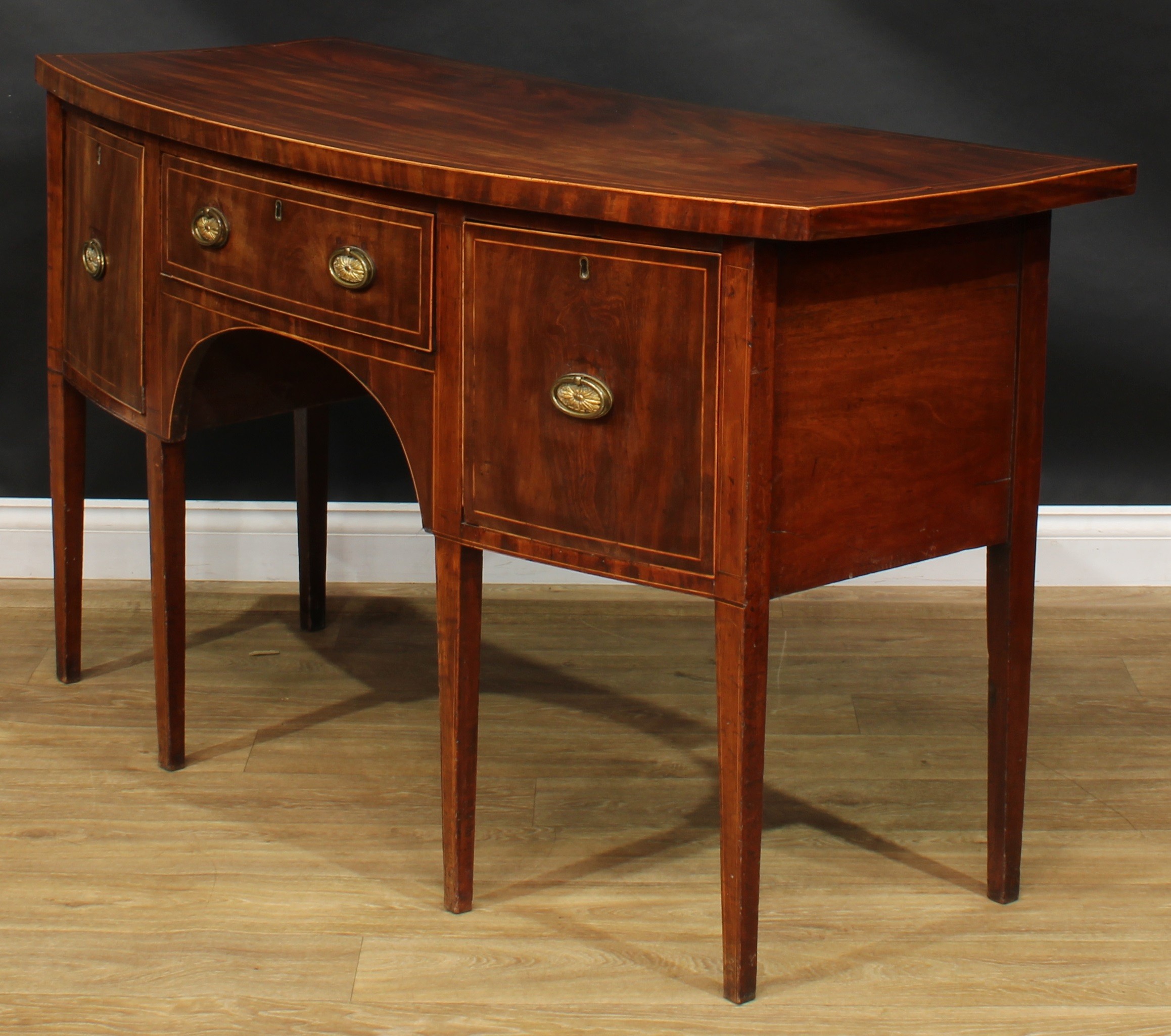 A George III mahogany bowfront sideboard or serving table, oversailing satinwood banded top above - Image 5 of 6