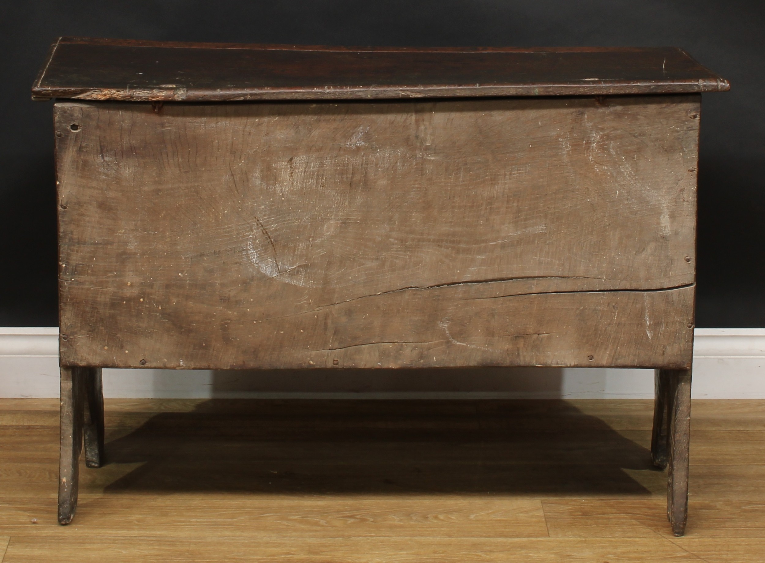 A 17th century elm six plank chest, hinged top enclosing a till, the front carved with leafy - Image 5 of 5