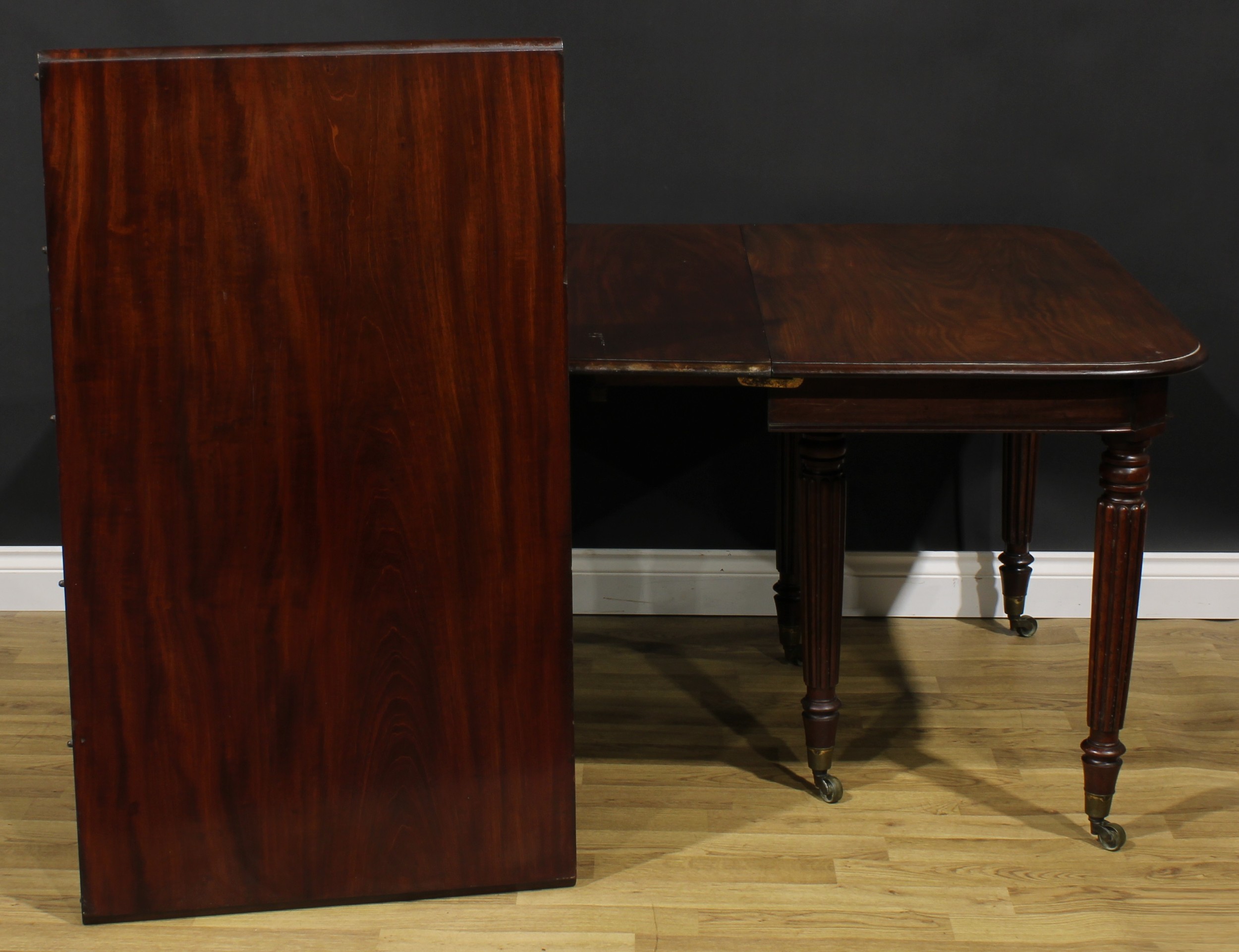 A George/William IV mahogany extending dining table, rounded rectangular top with two - Image 4 of 4