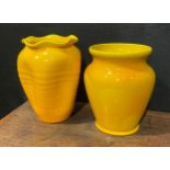 A Burmantofts Faience dimpled ovoid vase, flared frilled rim, glazed throughout in yellow, 12.5cm