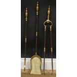 A 19th century steel and brass fireside companion set, comprising shovel, poker and tongs, the