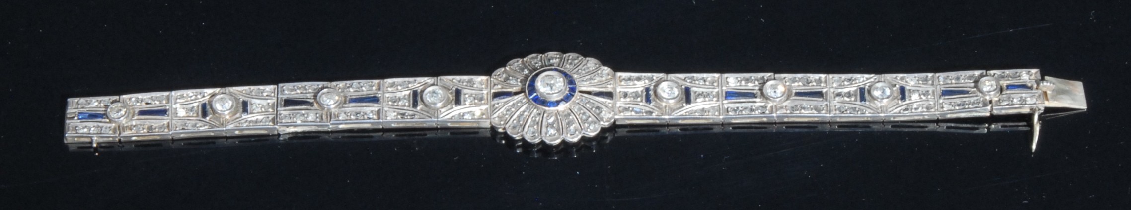 An Art Deco diamond and sapphire panel bracelet in the manner of Cartier, each panel centered with - Image 2 of 2
