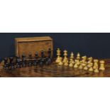 A boxwood and ebonised Staunton pattern chess set, the Kings 8cm high