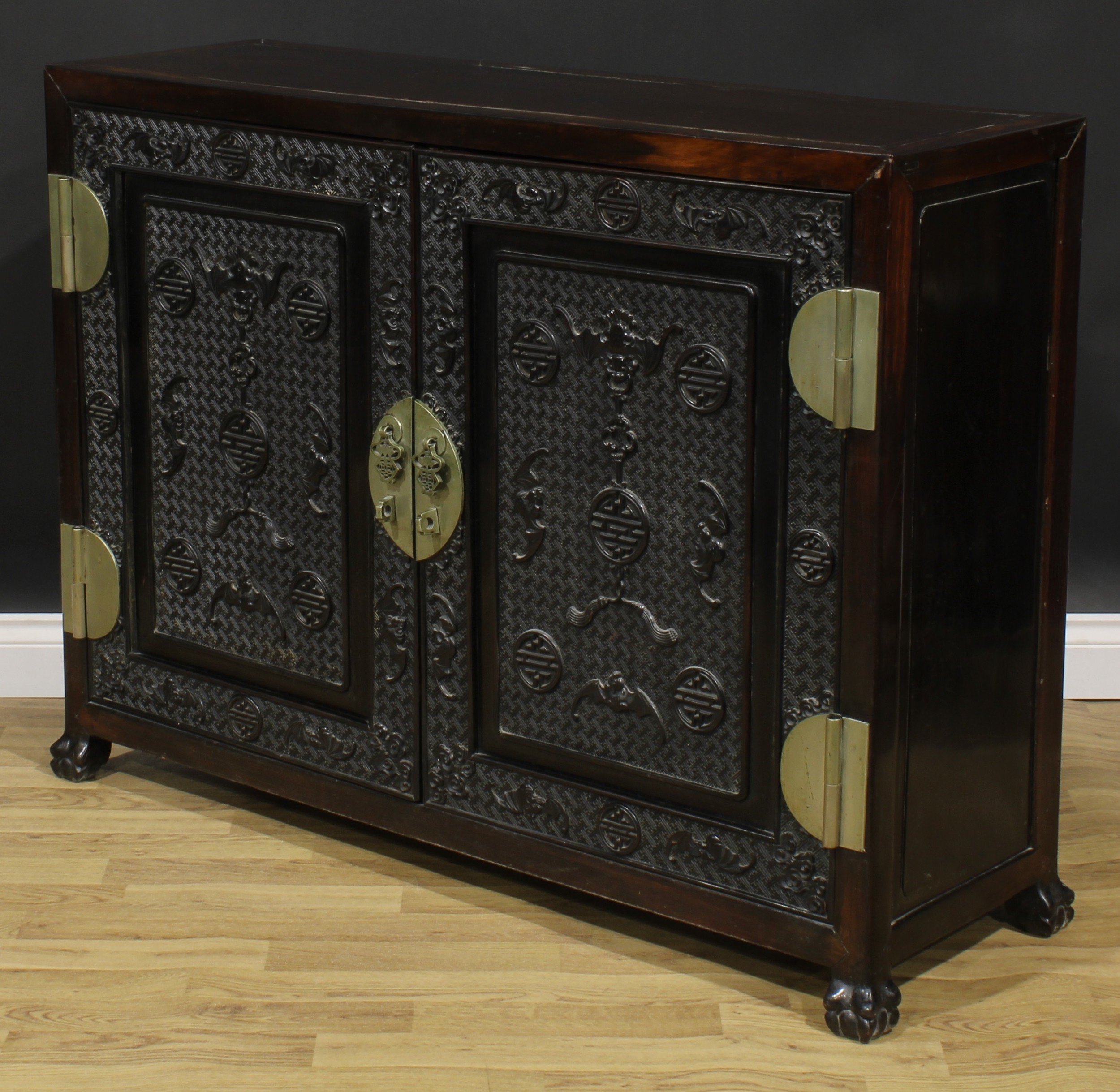 A Chinese hardwood side cabinet, rectangular top above a pair of panel doors carved and applied with - Image 5 of 6