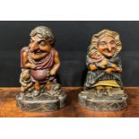 A pair of 19th century cold painted cast iron Punch and Judy doorstops, Punch dressed as a Roman and