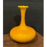 A Burmantofts Faience compressed ovoid bottle vase, slender elongated neck, flared frilled rim,