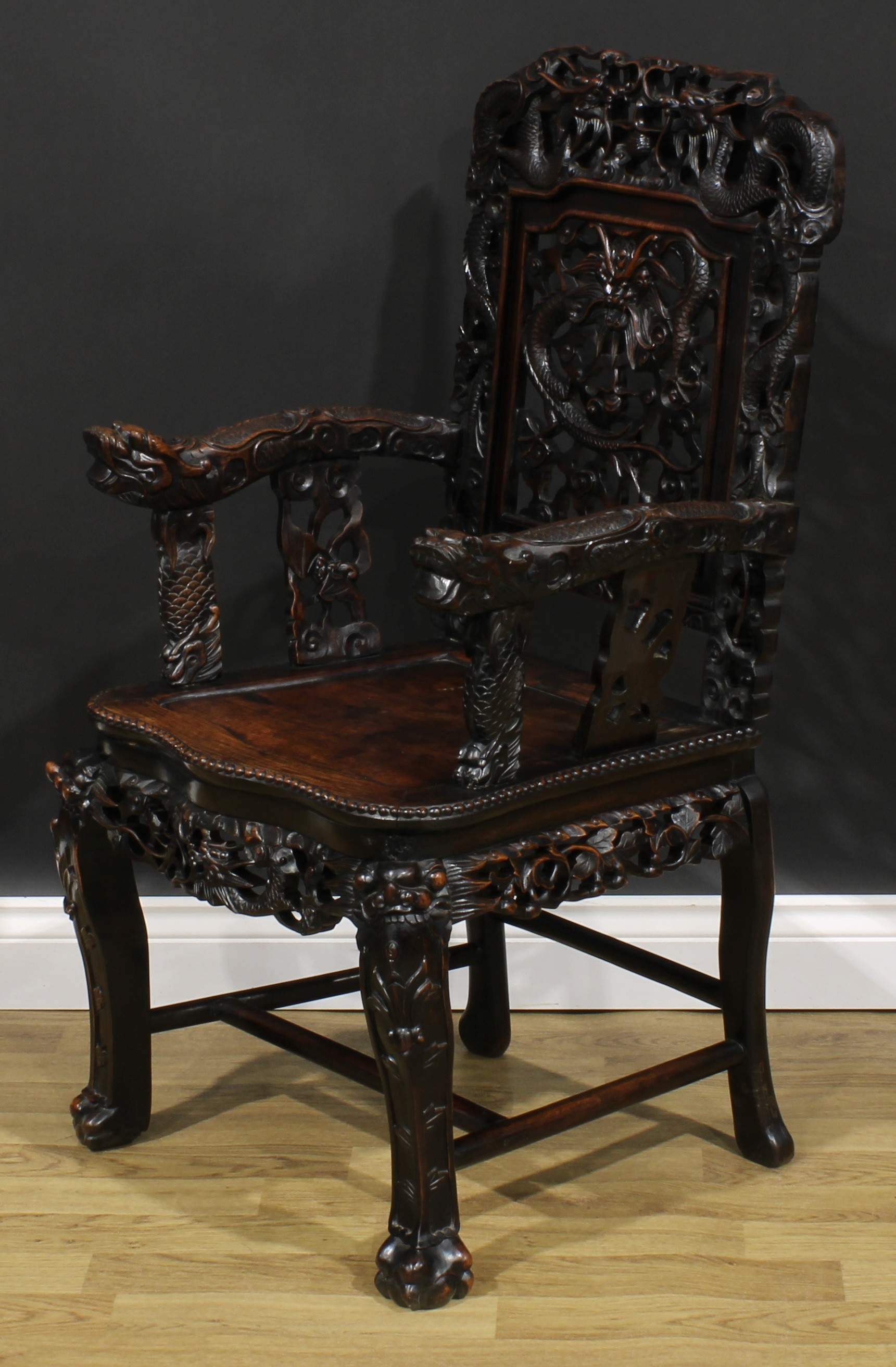 A Chinese hardwood armchair, carved throughout with dragons, serpentine seat with beaded border, - Image 3 of 4