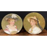 A near pair of Aesthetic Movement circular plaques, painted by Magda Osborne Hilliard, with ladies