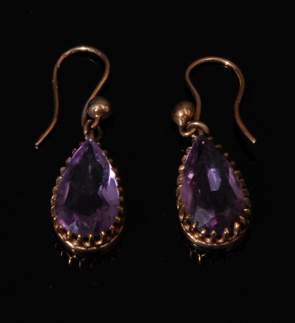 A 9ct rose gold and amethyst necklace and earring suite, the necklace set with nine graduated oval - Image 3 of 3