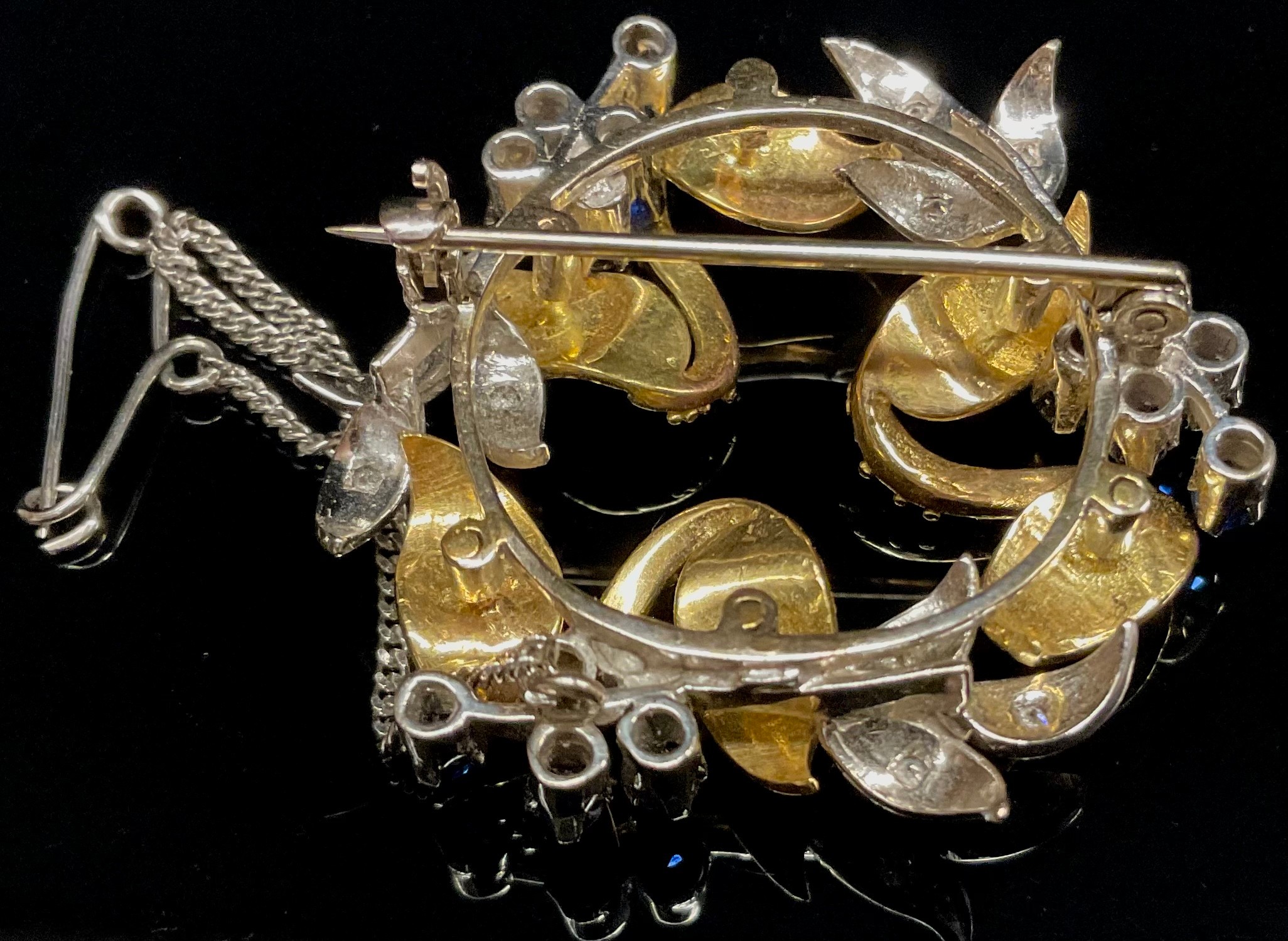 An 18ct white and yellow gold wreath brooch, formed from intertwined flowering stems and leaves, the - Image 2 of 2