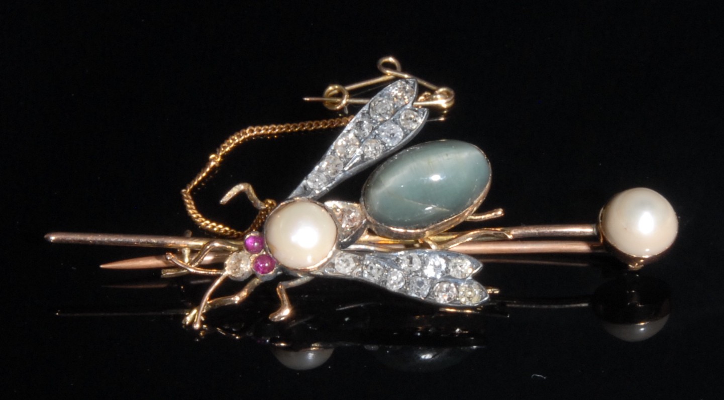 An early 20th century diamond, ruby, pearl and cats eye chrysoberyl insect brooch, set with two