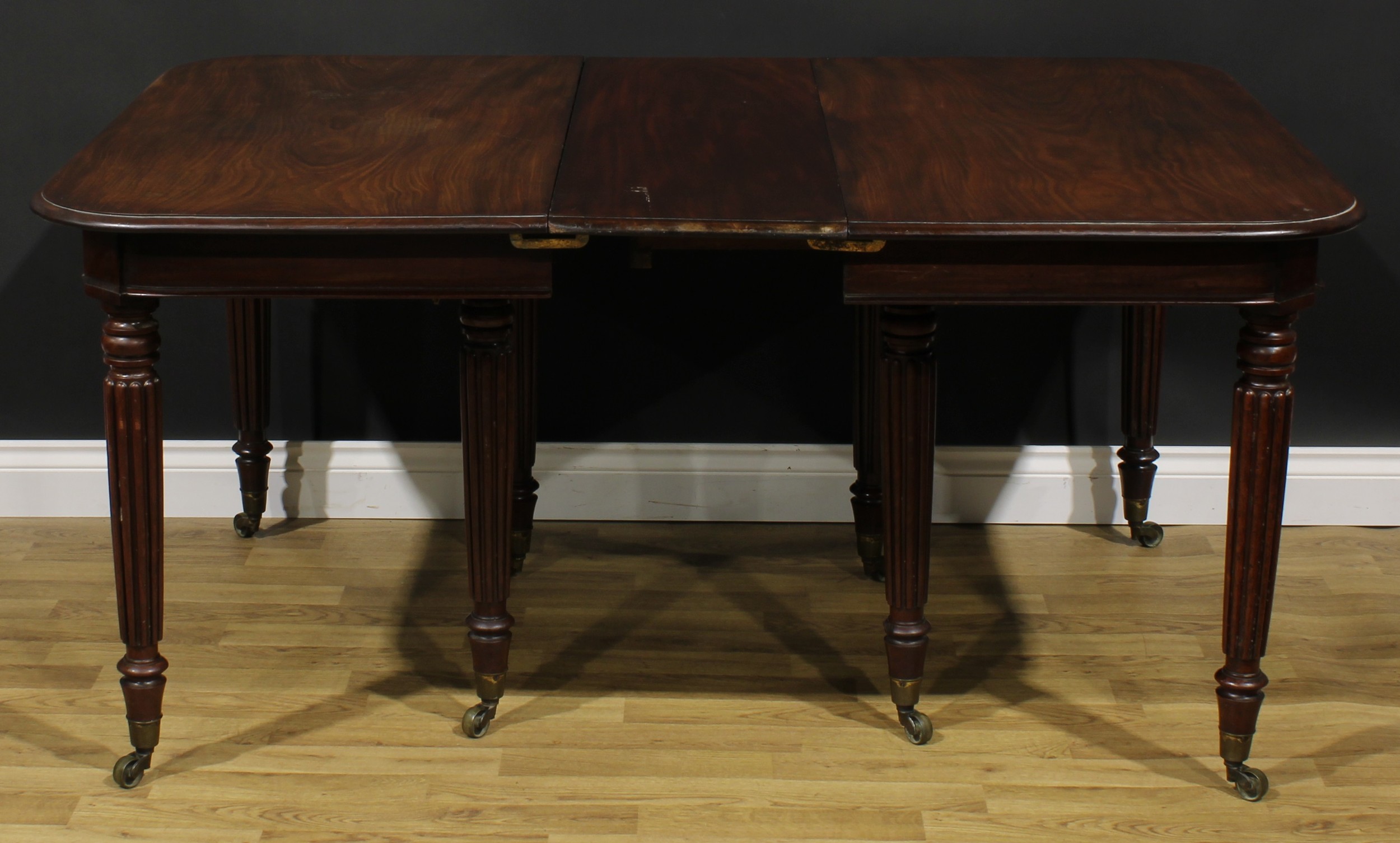 A George/William IV mahogany extending dining table, rounded rectangular top with two - Image 3 of 4