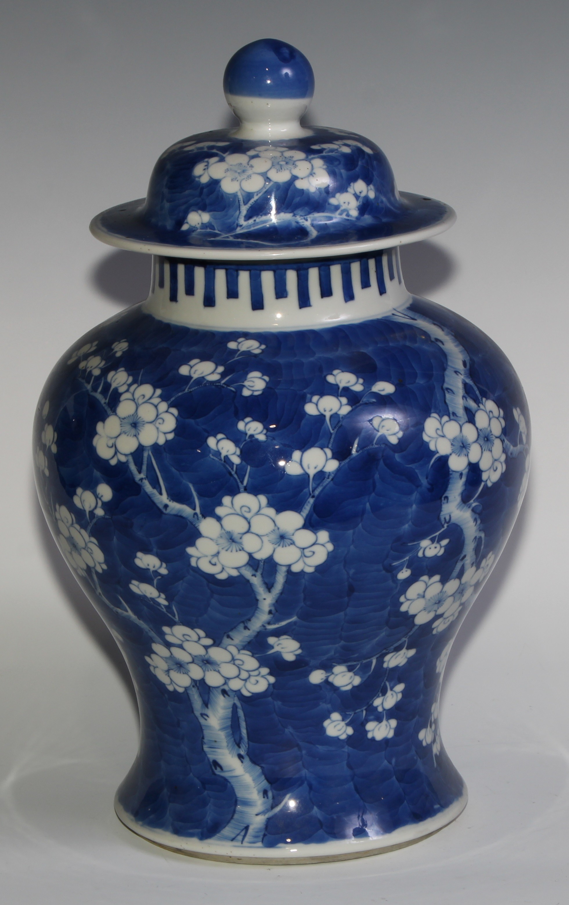 A Chinese baluster jar and cover, painted in tones of underglaze blue with blossoming prunus on a - Image 3 of 6