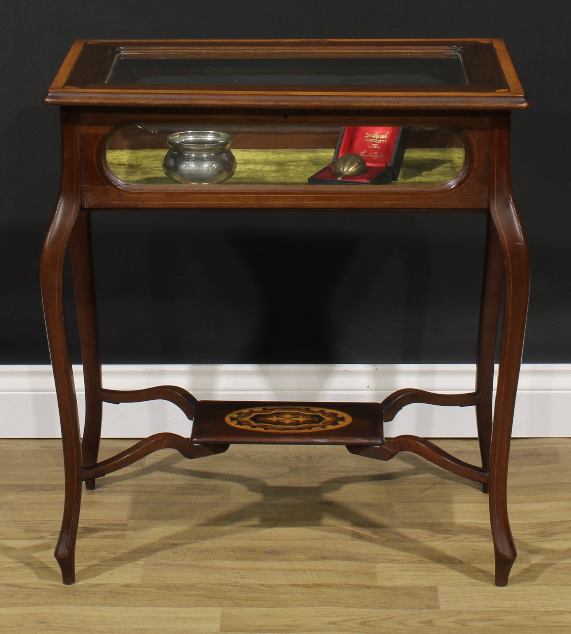 An Edwardian satinwood banded mahogany and marquetry bijouterie table, hinged top, French cabriole