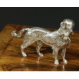A silver plated table decoration, cast as a gun dog holding a pheasant, 22cm long