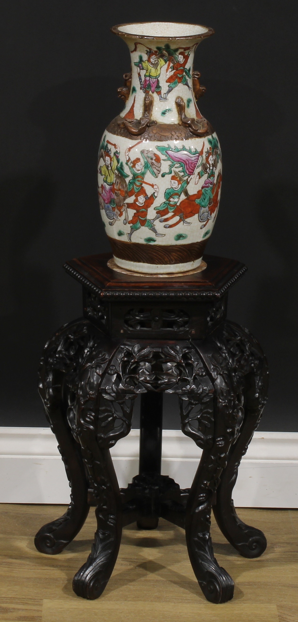 A Chinese hardwood jardiniere stand, pentagonal top with beaded border and inset marble panel,