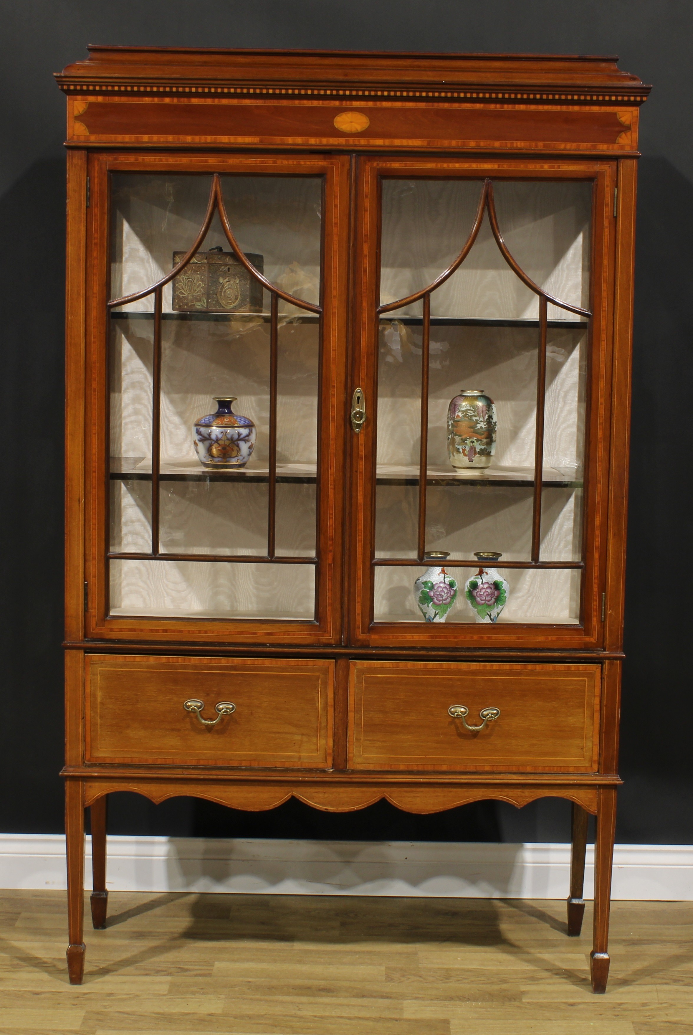 A Sheraton Revival satinwood crossbanded mahogany and marquetry display cabinet, moulded cornice