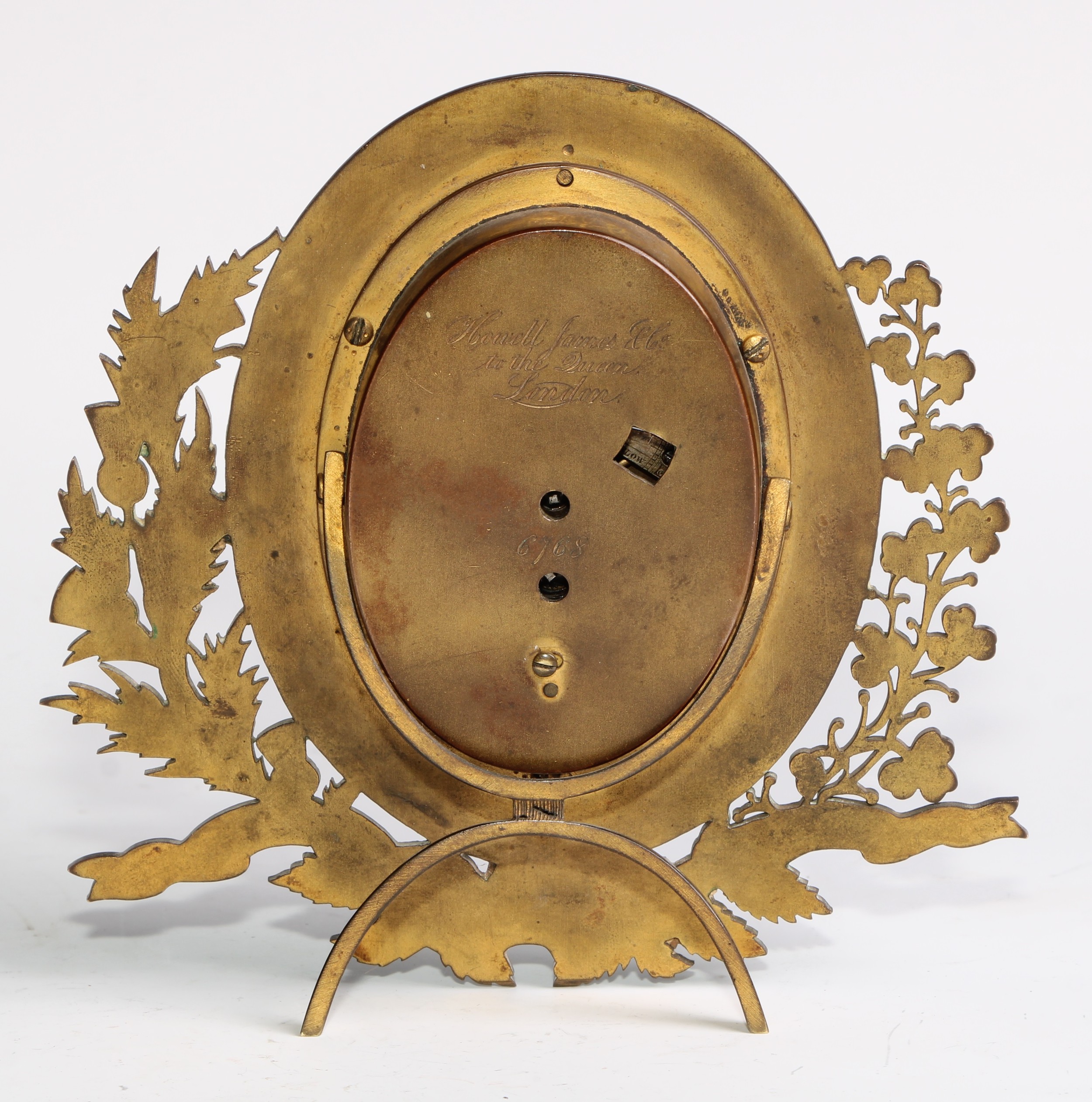 A Victorian gilt brass strut easel timepiece, by Howell James & Co, oval silvered clock dial - Image 4 of 5