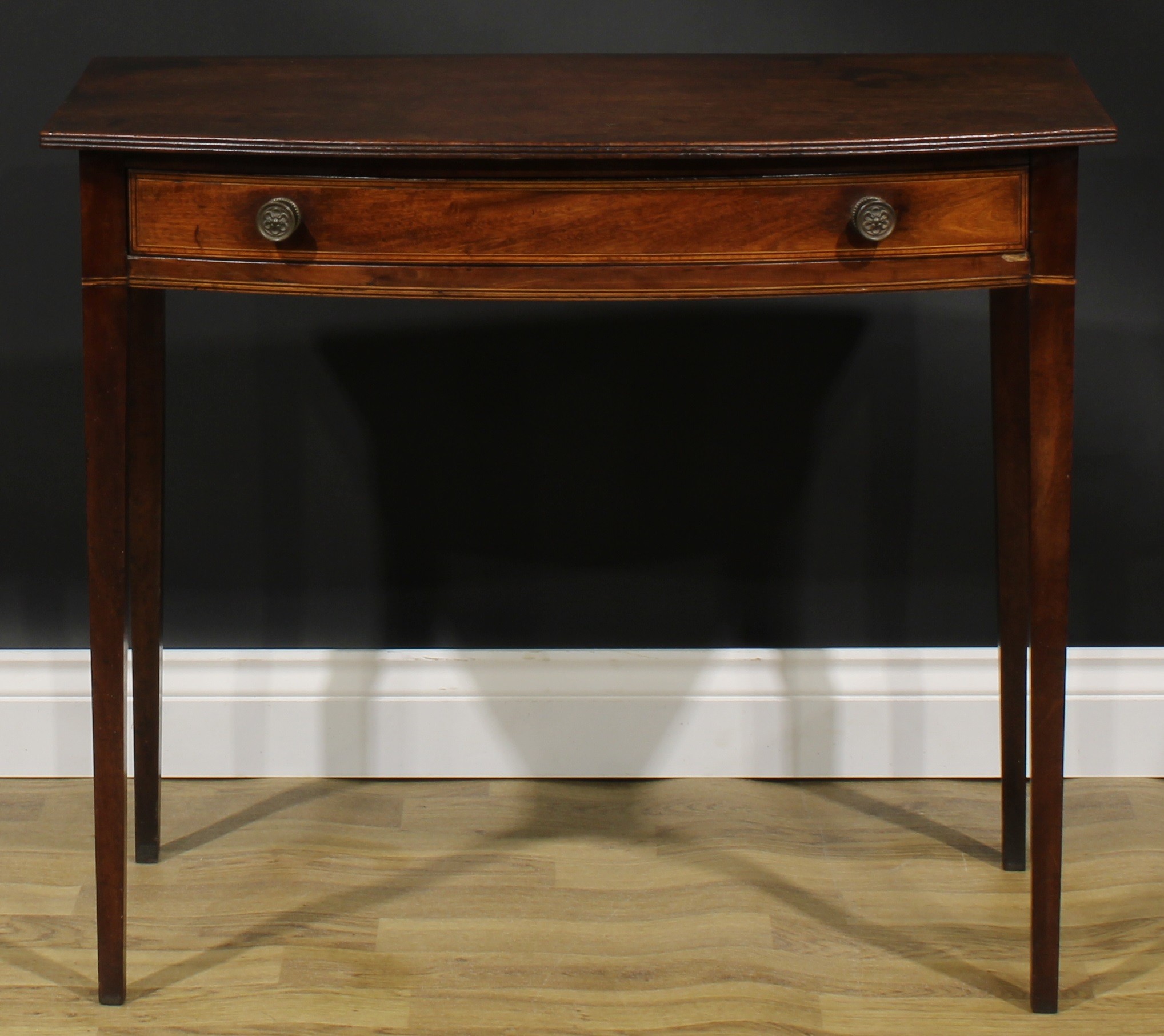 A George III mahogany bowfront side table, oversailing top with reeded edge above a long satinwood - Image 2 of 6