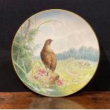A Minton Aesthetic Movement circular charger, painted by A H Wright, signed and dated 1880, with a
