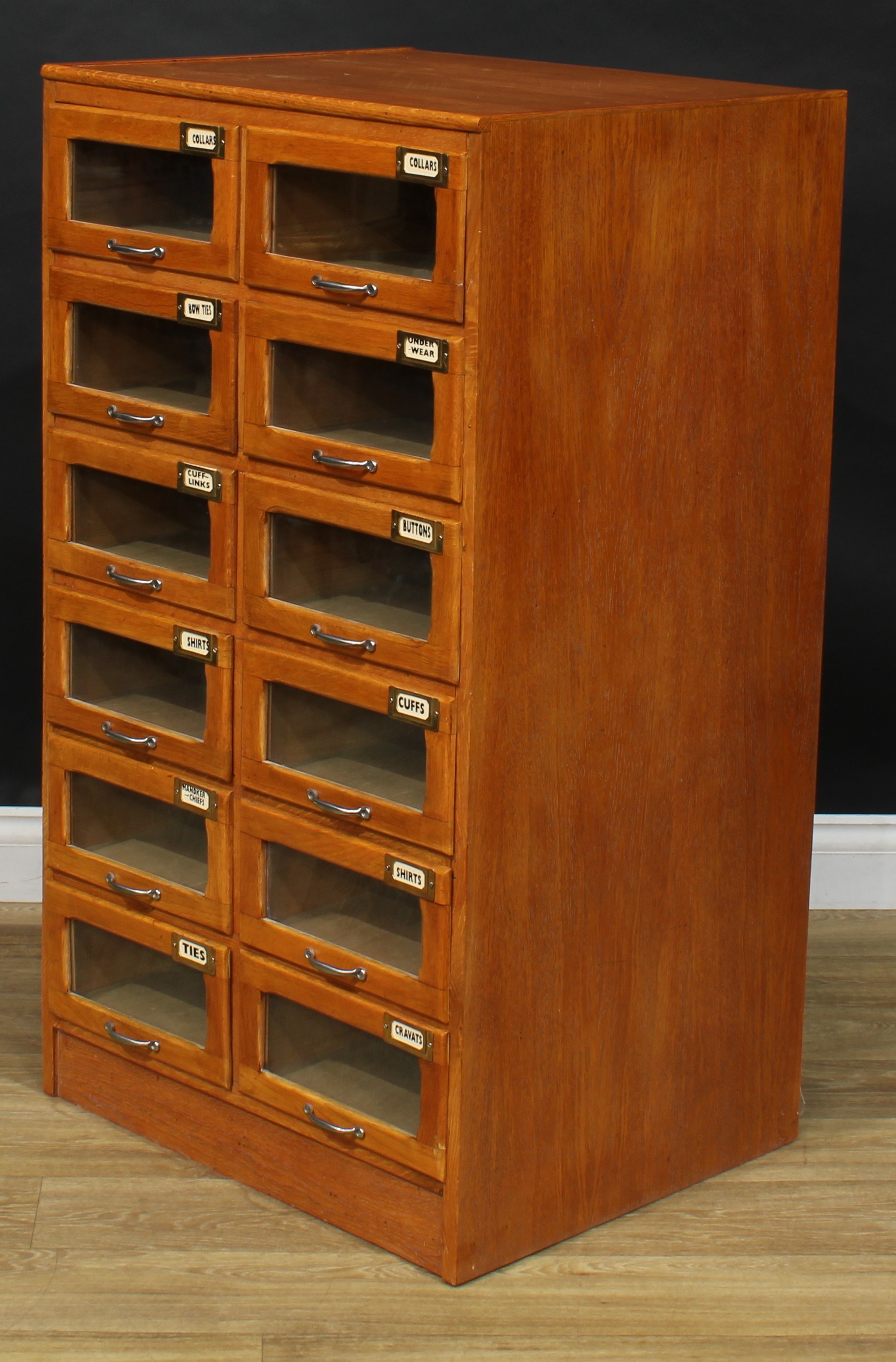 An early to mid 20th century oak haberdashery shop display chest, rectangular top above twelve - Image 4 of 5