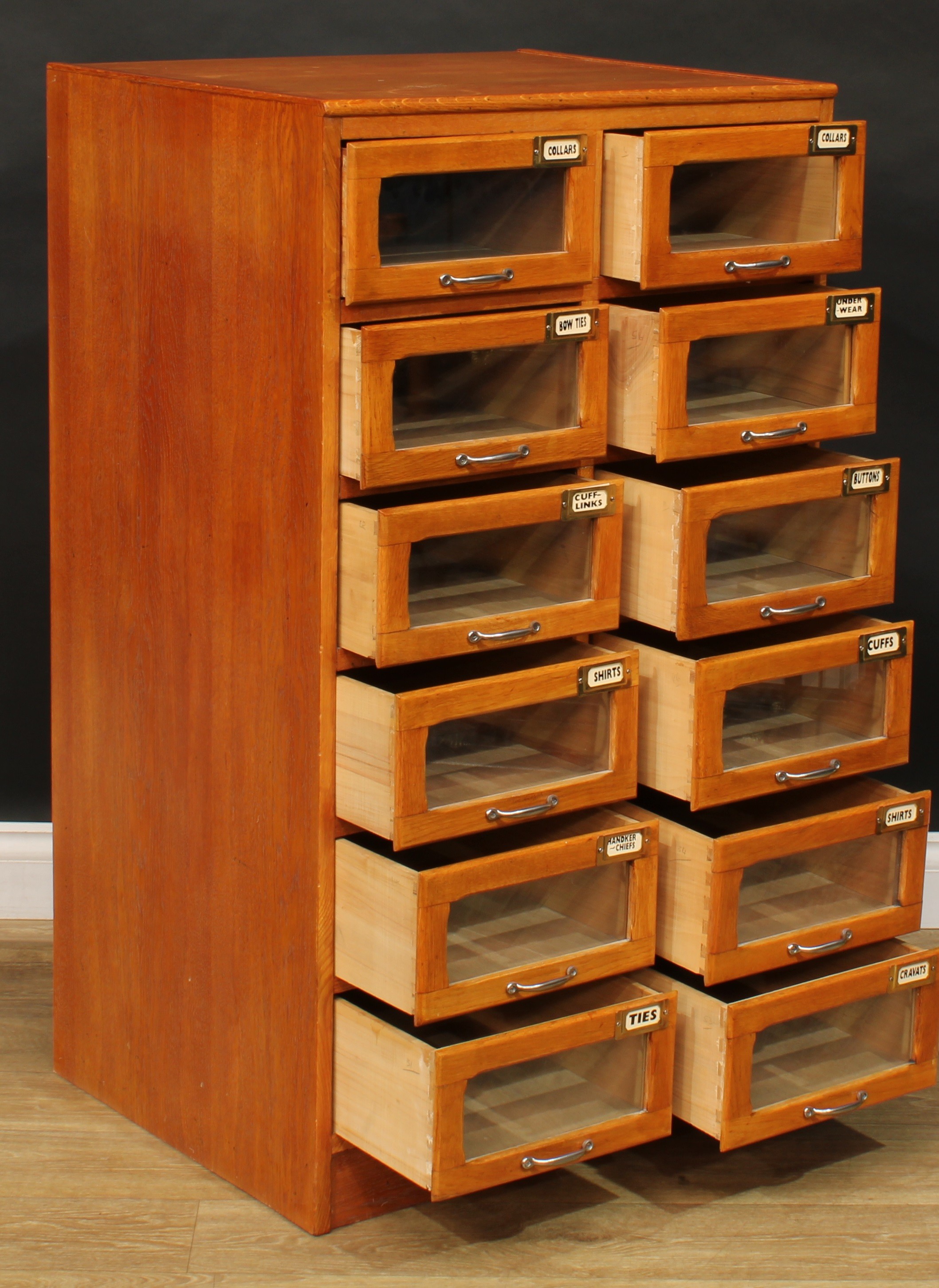 An early to mid 20th century oak haberdashery shop display chest, rectangular top above twelve - Image 3 of 5