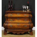 A 19th century Dutch oak and marquetry bombe chest, of three long graduated drawers, inlaid