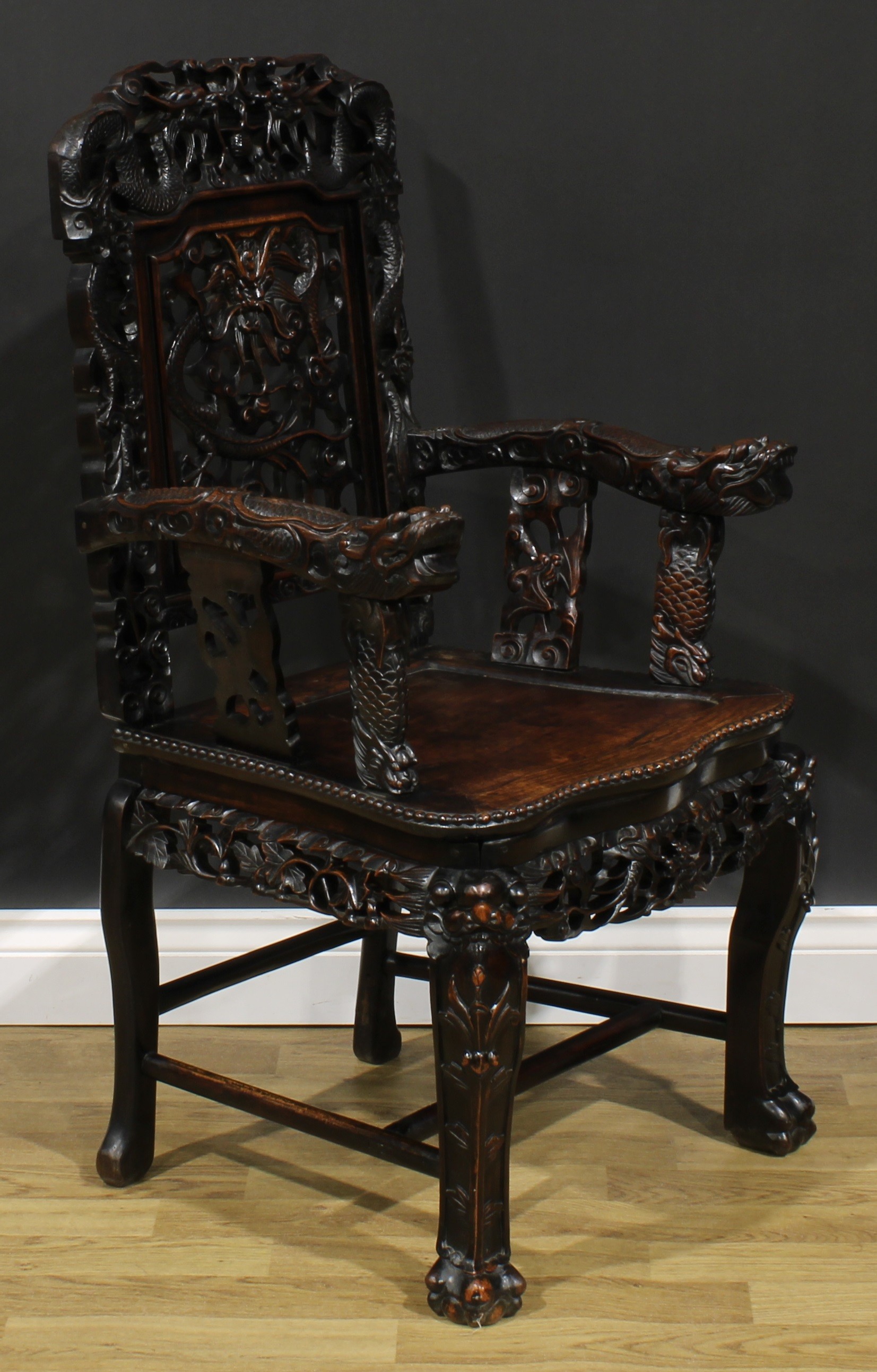 A Chinese hardwood armchair, carved throughout with dragons, serpentine seat with beaded border, - Image 2 of 4