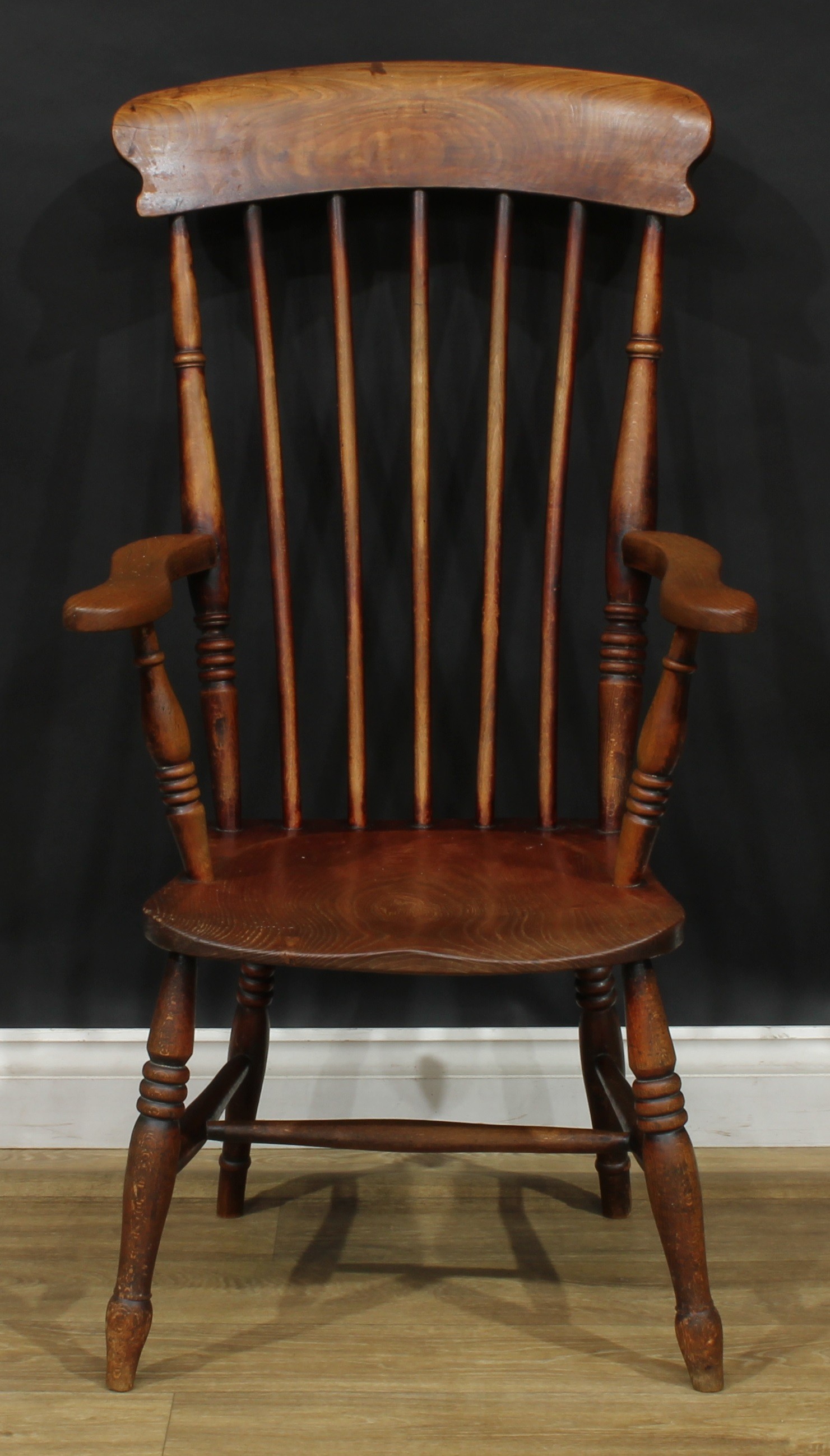 A 19th century elm, ash and beech stick back Windsor kitchen armchair, 108cm high, 58cm wide, the